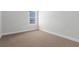 Bedroom featuring neutral carpet, white trim, and a sunlit window at 2443 Campton Loop, Conway, SC 29527