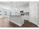 Modern kitchen with a center island, stainless steel appliances, and hardwood floors at 2443 Campton Loop, Conway, SC 29527