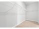 Walk-in closet featuring white wire shelving and neutral color carpet at 2443 Campton Loop, Conway, SC 29527