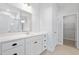 Bathroom with double sink vanity, white cabinetry, and a glass-enclosed shower at 2473 Campton Loop, Conway, SC 29527