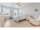 Bright bedroom featuring beach-themed decor, a ceiling fan, and wood-look flooring at 2476 Blue Crane Circle # 101, Myrtle Beach, SC 29577
