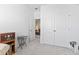 Bedroom featuring an open door, closet, and a view into the living room at 2476 Blue Crane Circle # 101, Myrtle Beach, SC 29577