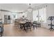 Open concept dining area with stylish chandelier and lots of seating at 2476 Blue Crane Circle # 101, Myrtle Beach, SC 29577