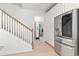 Open-concept kitchen with stainless steel refrigerator and staircase at 2476 Blue Crane Circle # 101, Myrtle Beach, SC 29577