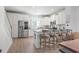 Open concept kitchen featuring island seating, stainless appliances, and white cabinetry at 2476 Blue Crane Circle # 101, Myrtle Beach, SC 29577
