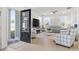 Open living room with natural light, modern furnishings, and seamless indoor-outdoor flow at 2476 Blue Crane Circle # 101, Myrtle Beach, SC 29577