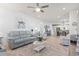 Spacious open-concept living area with modern decor, flowing into the dining and kitchen areas at 2476 Blue Crane Circle # 101, Myrtle Beach, SC 29577