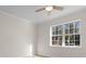 Bright bedroom with a ceiling fan and a large window bringing in natural light and a view at 2483 Morlynn Dr., Myrtle Beach, SC 29577