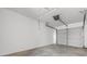 Spacious garage with a white door, overhead light fixture, and concrete floors at 2483 Morlynn Dr., Myrtle Beach, SC 29577