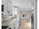 Modern kitchen open to dining area, featuring stainless appliances, tile backsplash and granite countertops at 2483 Morlynn Dr., Myrtle Beach, SC 29577