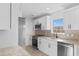 Bright kitchen featuring white cabinets, stainless steel appliances, granite countertops, and tile backsplash at 2483 Morlynn Dr., Myrtle Beach, SC 29577