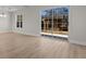 Bright living room with wood-look floors, neutral walls, large sliding glass doors to the backyard at 2483 Morlynn Dr., Myrtle Beach, SC 29577