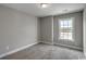 Bright bedroom featuring carpeted floors and a view from the window at 2582 Cottonwood Dr., Loris, SC 29569