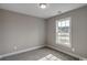 Neutral-toned bedroom with carpeted floors and a bright window view at 2582 Cottonwood Dr., Loris, SC 29569