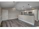 Modern kitchen with white cabinets, stainless steel appliances, granite countertops, and pendant lighting at 2582 Cottonwood Dr., Loris, SC 29569