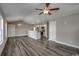 Bright living space with vaulted ceiling, modern light fixtures, and an open view into the kitchen area at 2582 Cottonwood Dr., Loris, SC 29569