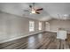 Open-concept living room with vaulted ceiling, ceiling fan, recessed lighting, and luxury vinyl plank flooring at 2582 Cottonwood Dr., Loris, SC 29569