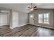Inviting living area featuring luxury vinyl plank floors, natural light, vaulted ceilings, and neutral paint at 2582 Cottonwood Dr., Loris, SC 29569