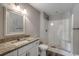 Bathroom featuring a granite vanity, a decorative mirror, and a shower-tub combination at 2588 Cottonwood Dr., Loris, SC 29569