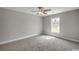 Cozy bedroom with neutral walls and plush carpeting, enhanced by natural light from a window at 2588 Cottonwood Dr., Loris, SC 29569