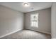 Bedroom with a light fixture, neutral walls, carpet, and a window providing natural light at 2588 Cottonwood Dr., Loris, SC 29569