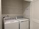 Convenient laundry area with a washer, dryer, and shelving for storage, making laundry day a breeze at 269 Christiana Ln. # B, Myrtle Beach, SC 29579