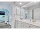 Bright bathroom with double sink vanity, ample storage, and a large mirror reflecting natural light at 300 Shorehaven Dr. # A4, North Myrtle Beach, SC 29582