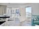 Bright dining area with sliding glass doors leading to a balcony, enhancing natural light at 300 Shorehaven Dr. # A4, North Myrtle Beach, SC 29582
