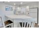 Well-lit kitchen featuring white cabinets, modern appliances, and quartz countertops, perfect for cooking at 300 Shorehaven Dr. # A4, North Myrtle Beach, SC 29582