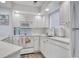 Updated kitchen featuring white cabinets, modern appliances, and great natural light, perfect for culinary adventures at 300 Shorehaven Dr. # A4, North Myrtle Beach, SC 29582