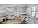 Bright kitchen and dining area with white cabinets, modern appliances, and access to outdoor balcony at 300 Shorehaven Dr. # A4, North Myrtle Beach, SC 29582