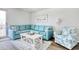 Comfortable living room featuring a plush sectional sofa, patterned armchair, and stylish decor at 300 Shorehaven Dr. # A4, North Myrtle Beach, SC 29582