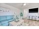Bright living room with comfortable seating, beachy decor, and a flat-screen TV for relaxation at 300 Shorehaven Dr. # A4, North Myrtle Beach, SC 29582