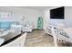 Coastal living room with wood floors, modern furniture, and a flat-screen television for relaxing evenings at 300 Shorehaven Dr. # A4, North Myrtle Beach, SC 29582