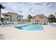 Community pool with lounge chairs and palm trees, surrounded by condos at 300 Shorehaven Dr. # A4, North Myrtle Beach, SC 29582