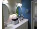 Bathroom featuring a double sink vanity, oval mirrors, and a modern indoor garden for a touch of nature at 3158 River Bluff Ln., Little River, SC 29566