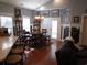 Bright dining room featuring a chandelier, dining table with seating, and access to the patio at 3158 River Bluff Ln., Little River, SC 29566