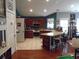 Eat-in kitchen featuring custom cabinets, stainless steel appliances, and bar seating at 3158 River Bluff Ln., Little River, SC 29566