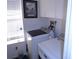 Well-lit laundry room with a modern washer and dryer, with bright natural light from the window at 3158 River Bluff Ln., Little River, SC 29566
