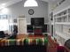Bright living room with hardwood floors, clerestory windows, built-in shelving, and comfortable seating at 3158 River Bluff Ln., Little River, SC 29566