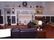 Cozy living room with built-in shelving, hardwood floors, and comfortable seating at 3158 River Bluff Ln., Little River, SC 29566