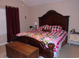 Comfortable bedroom featuring a king-size bed with upholstered headboard and side tables at 3158 River Bluff Ln., Little River, SC 29566