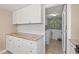 Kitchen with tile flooring, stainless appliances and granite countertops leading to the Laundry Room at 328 Salt Marsh Circle # 9D, Pawleys Island, SC 29585