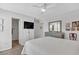 This bedroom features a bed, ceiling fan, ensuite bathroom and a dresser at 3557 Chestnut Dr. # 3557, Myrtle Beach, SC 29577