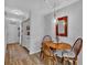 Cozy dining area featuring a wood table, stylish light fixture, and easy access to laundry area at 3557 Chestnut Dr. # 3557, Myrtle Beach, SC 29577