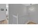 Hallway featuring a unique light fixture, white railing and view of the bedroom at 3557 Chestnut Dr. # 3557, Myrtle Beach, SC 29577