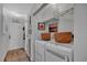 Functional hallway with a laundry area and access to the front door at 3557 Chestnut Dr. # 3557, Myrtle Beach, SC 29577