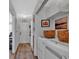 Functional hallway with a laundry area and access to the front door at 3557 Chestnut Dr. # 3557, Myrtle Beach, SC 29577