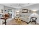 Bright living room with sliding doors to the outdoor patio, a comfortable couch, and breakfast bar at 3557 Chestnut Dr. # 3557, Myrtle Beach, SC 29577