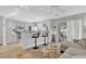 Bright living room features a breakfast bar, ceiling fan, and sliding doors to the patio at 3557 Chestnut Dr. # 3557, Myrtle Beach, SC 29577